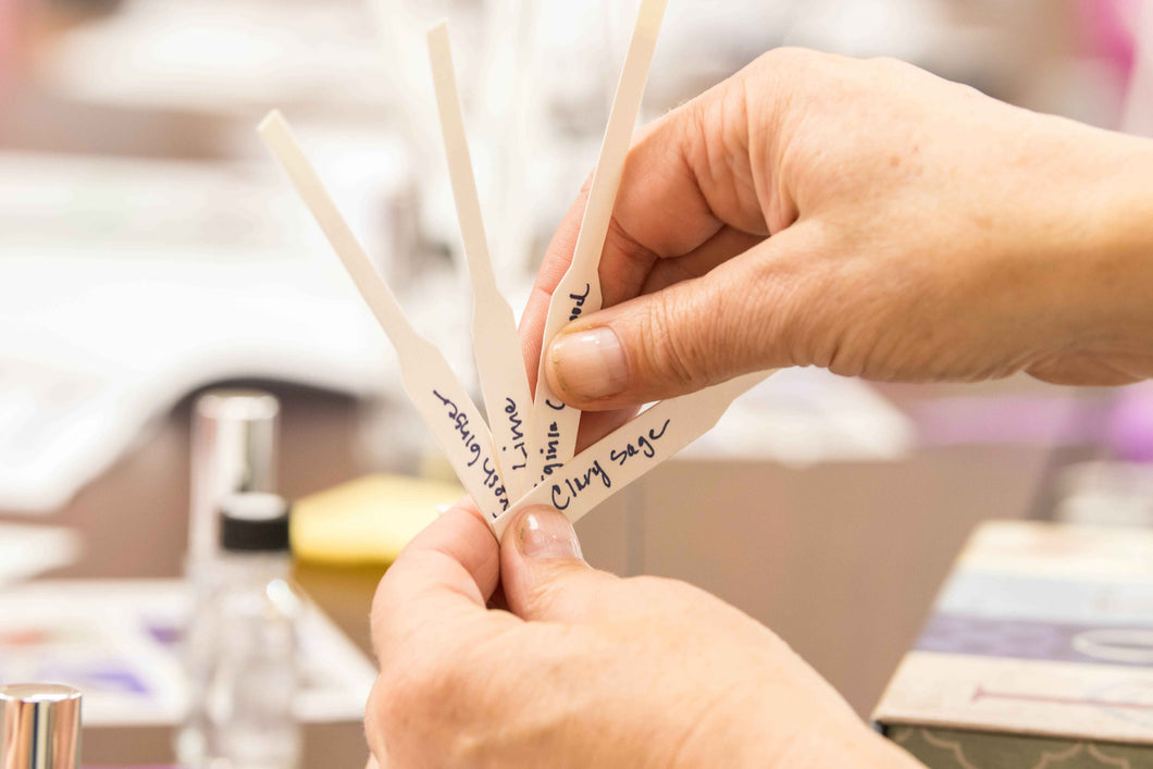 Scent strips dipped in essential oils, including Clary Sage, Lime, and Virginia Cedarwood, part of Sol Aromatics' perfume-making gift certificate experience